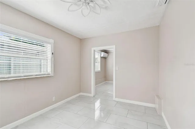 a view of an empty room with a window