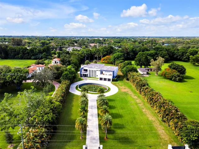 a view of a garden with houses