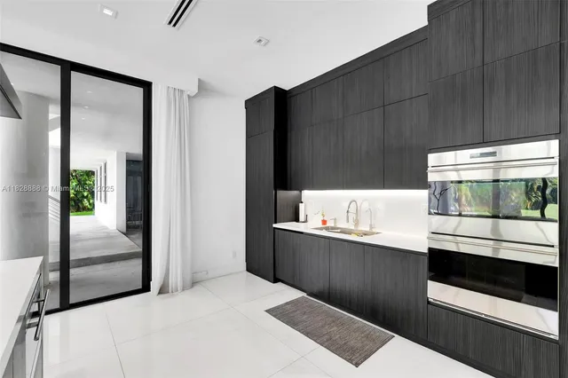 a room with furniture and a potted plant