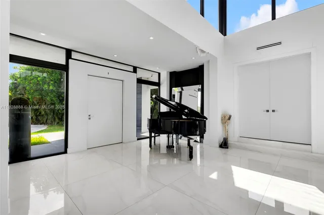 a bedroom with a large bed and a couch