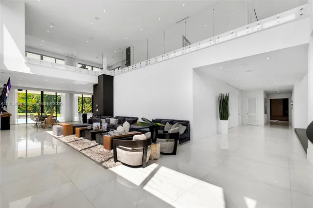 a bathroom with a shower sink and mirror