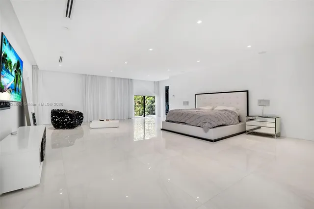 a view of a swimming pool with a lounge chairs and couches
