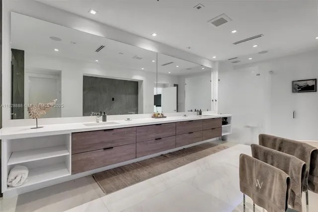 a view of swimming pool with a lounge chairs