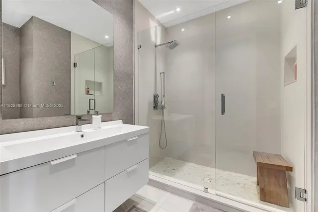 a living room with furniture a floor to ceiling window and a flat screen tv