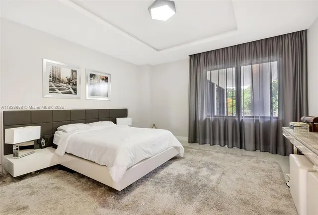 a view of a house with backyard and porch