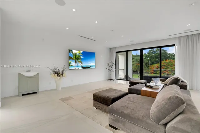 a couple of palm trees sitting in a yard with swimming pool