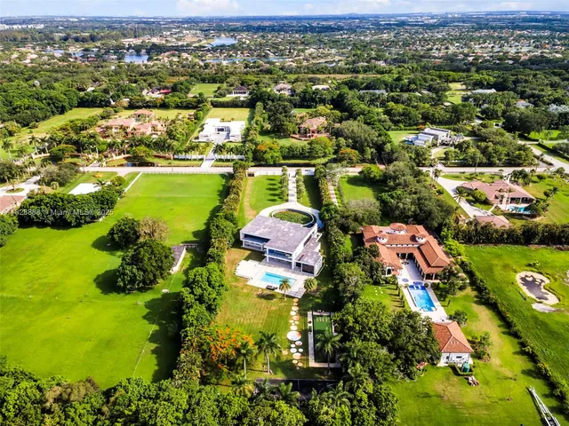 a kitchen with stainless steel appliances kitchen island sink refrigerator and stove