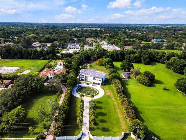 a kitchen with stainless steel appliances kitchen island granite countertop a sink and cabinets