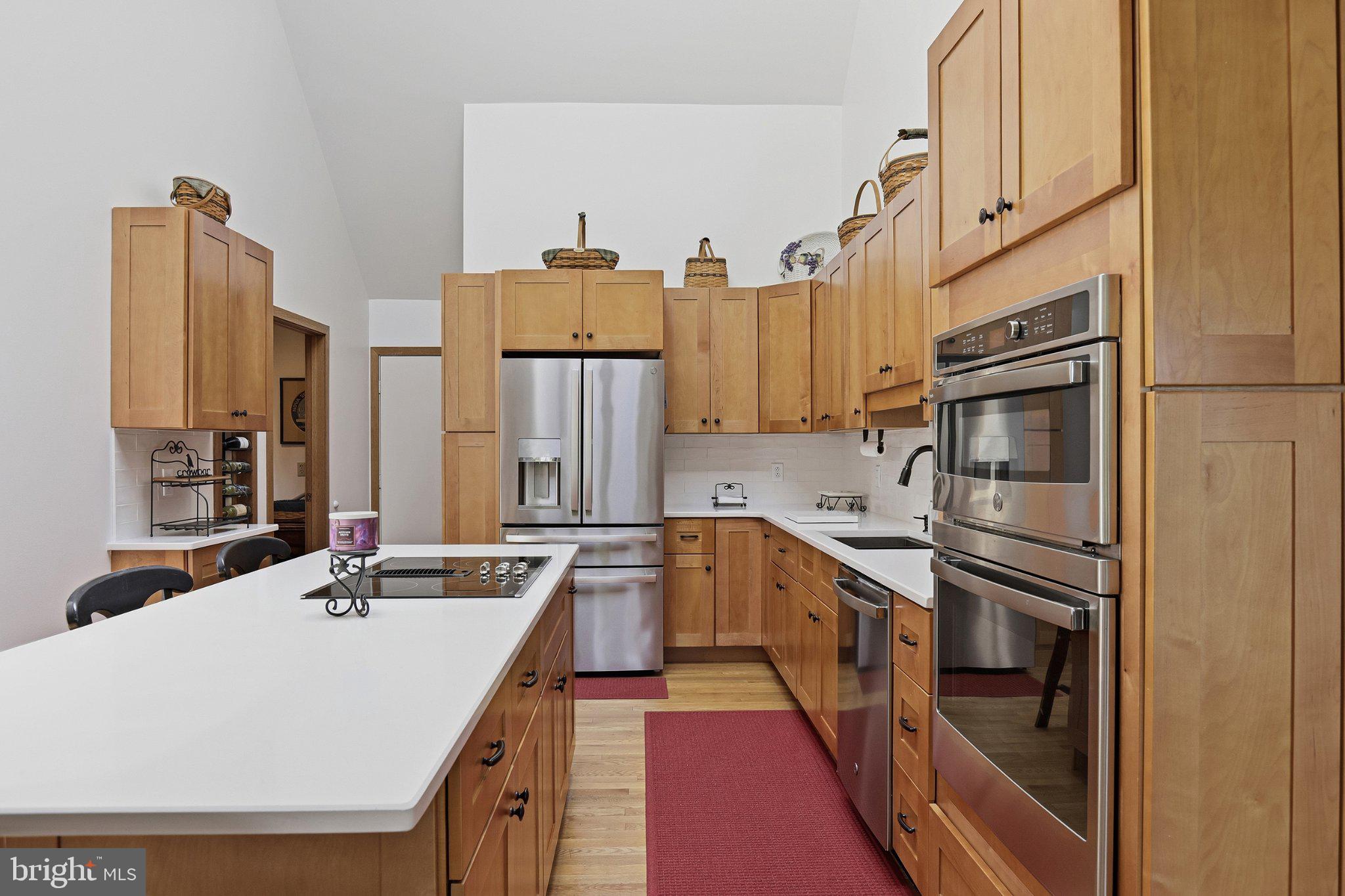 6495 Tides Road King George, VA 22485 - Photo 12 of 65 a kitchen with stainless steel appliances a sink and cabinets