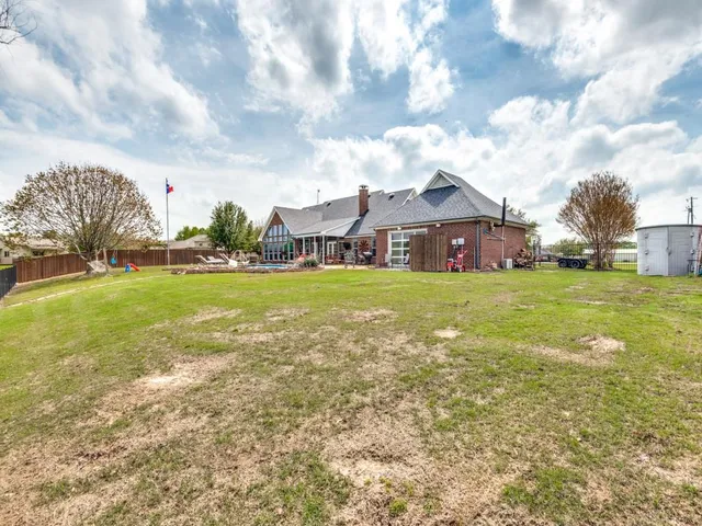 a view of a building with garden in front of it