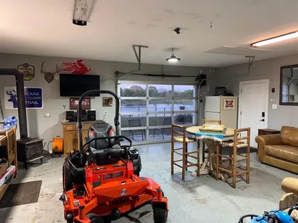 a room with furniture a air conditioner and a window