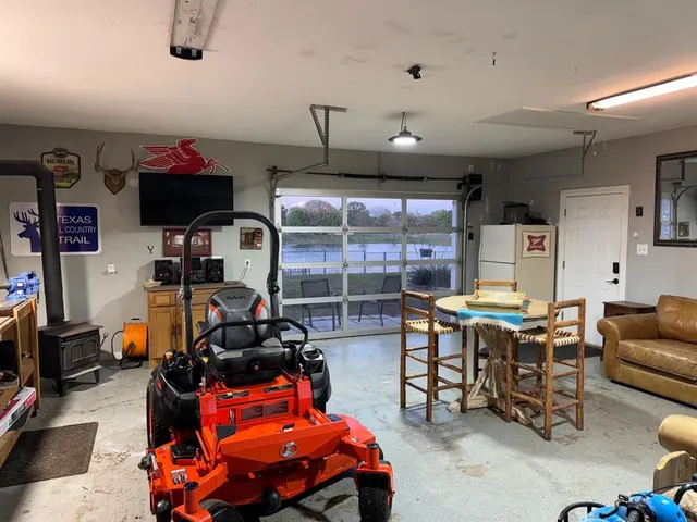 a room with furniture a air conditioner and a window