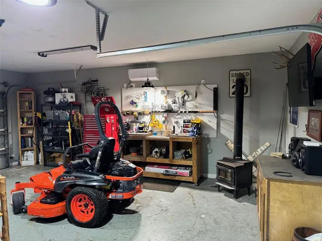 a living room with furniture a rug and a bookshelf