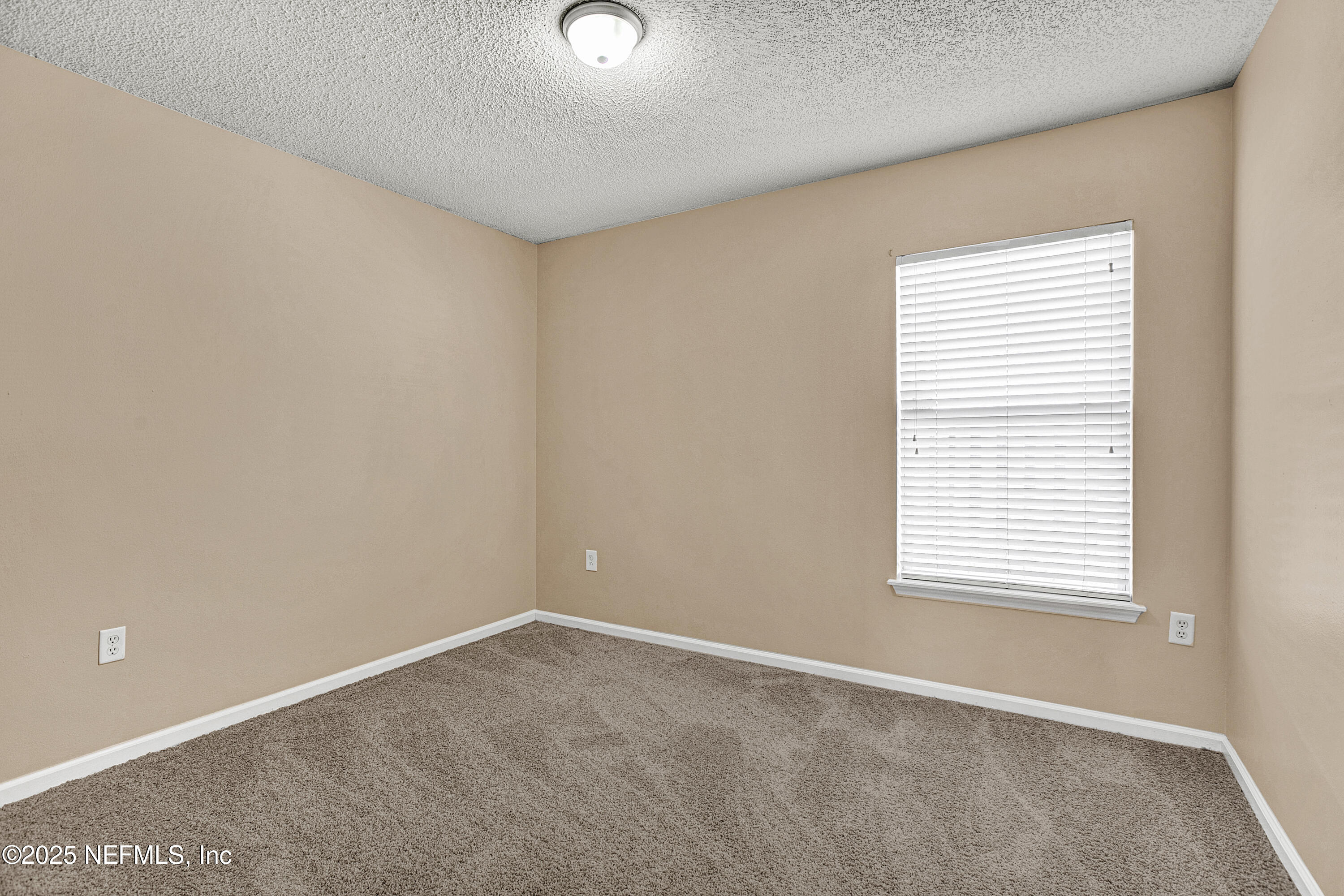 1164 Dawn Light Road Jacksonville, FL 32218 - Photo 12 of 19 an empty room with a window