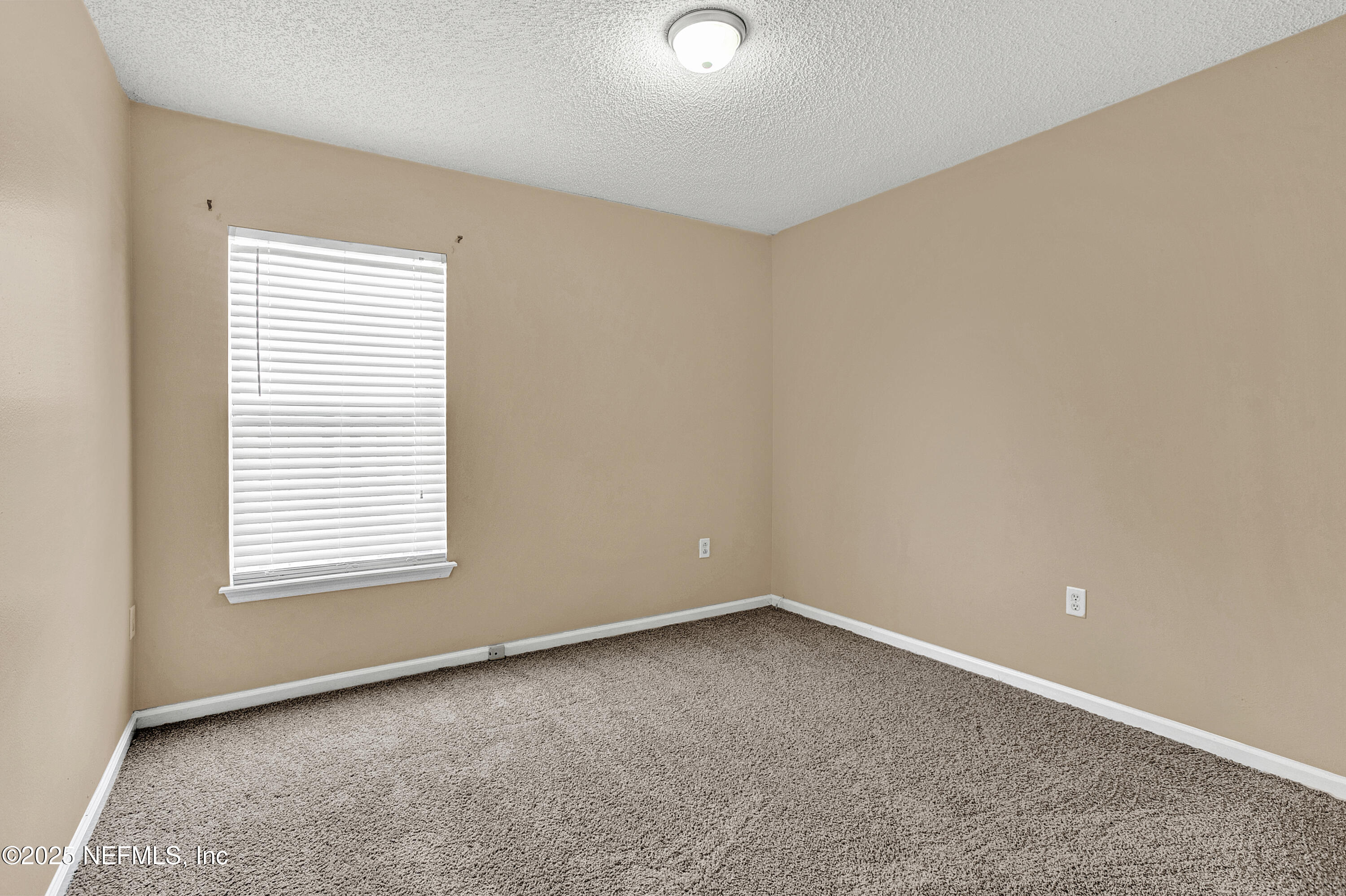 1164 Dawn Light Road Jacksonville, FL 32218 - Photo 14 of 19 an empty room with a window