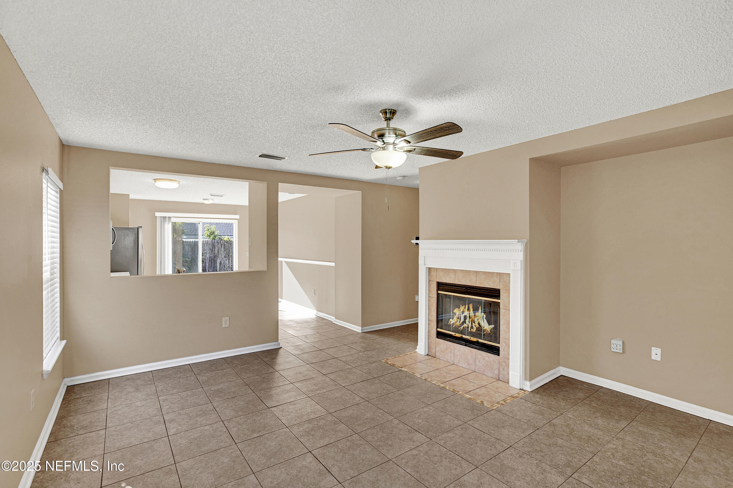 1164 Dawn Light Road Jacksonville, FL 32218 - Photo 3 of 19 a view of an empty room with a fireplace
