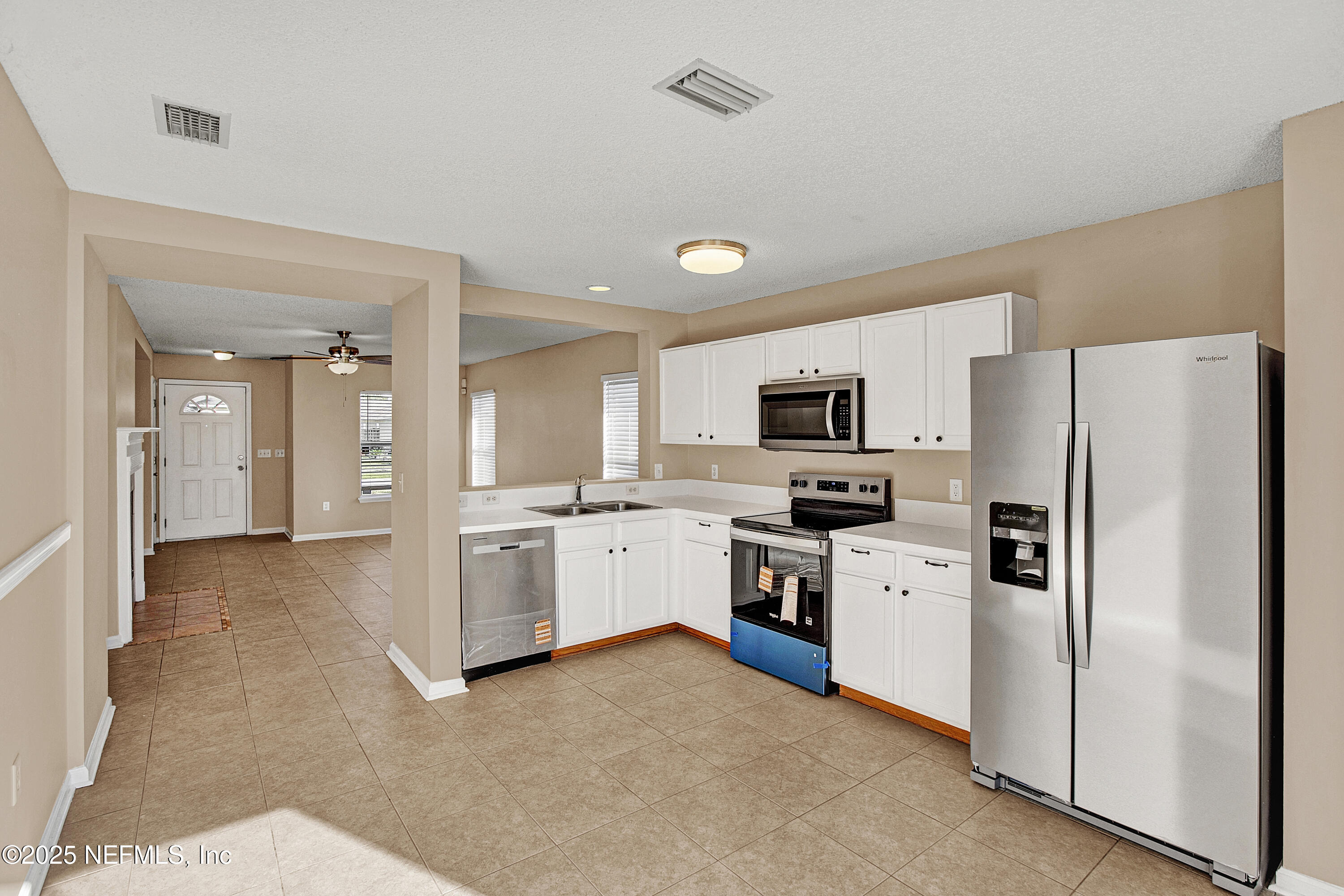 1164 Dawn Light Road Jacksonville, FL 32218 - Photo 5 of 19 a large kitchen with cabinets and stainless steel appliances