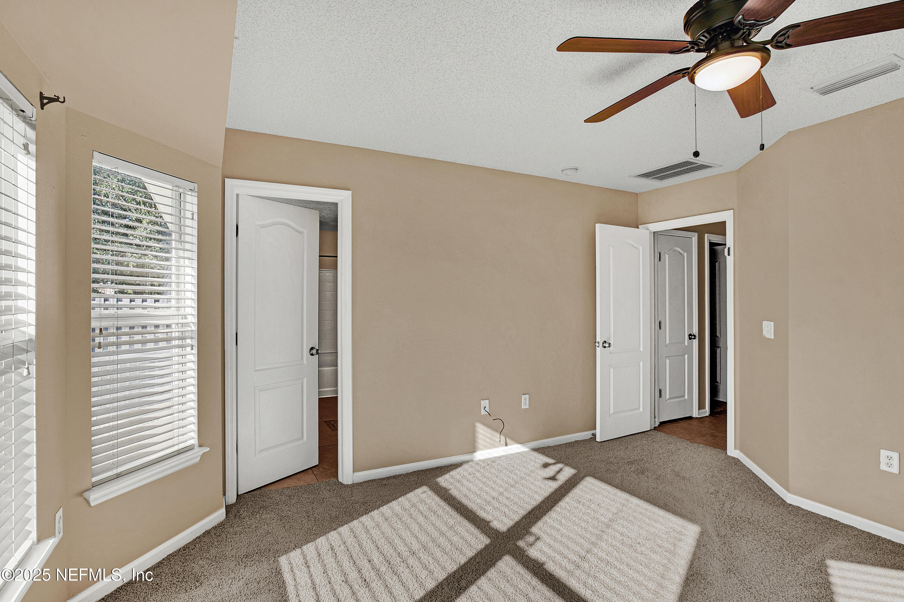 1164 Dawn Light Road Jacksonville, FL 32218 - Photo 10 of 19 a view of a bedroom with a sink and a chandelier fan
