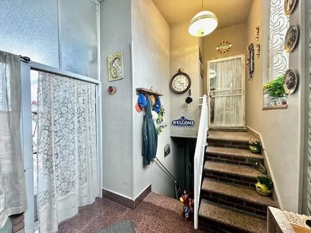a view of living room with furniture and a window