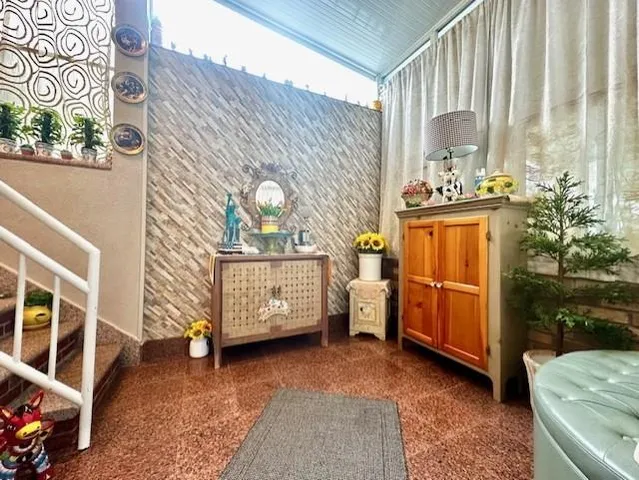 a kitchen with kitchen island granite countertop a sink a stove and a wooden cabinets
