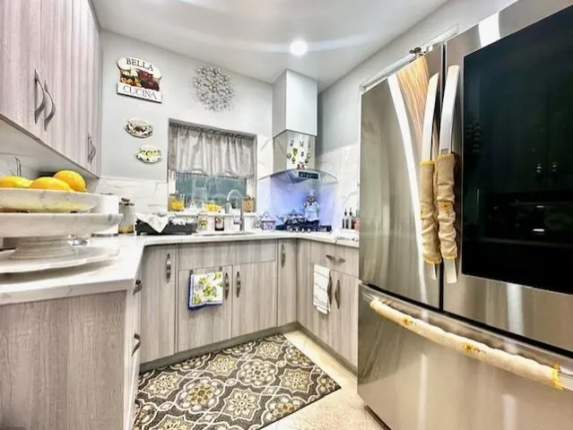 a table with a vase and a chandelier