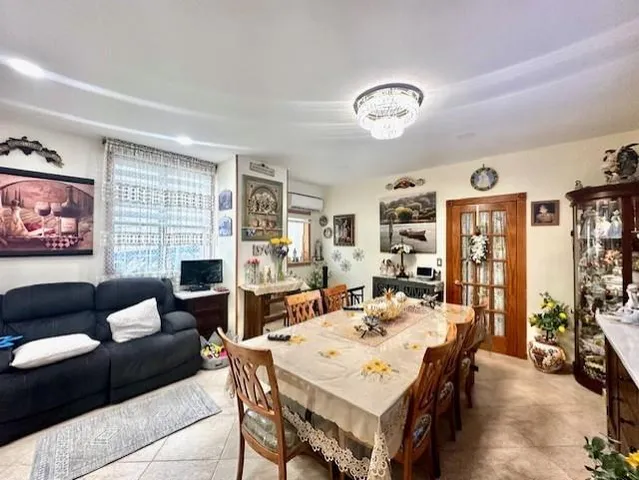 a kitchen with granite countertop white cabinets and stainless steel appliances
