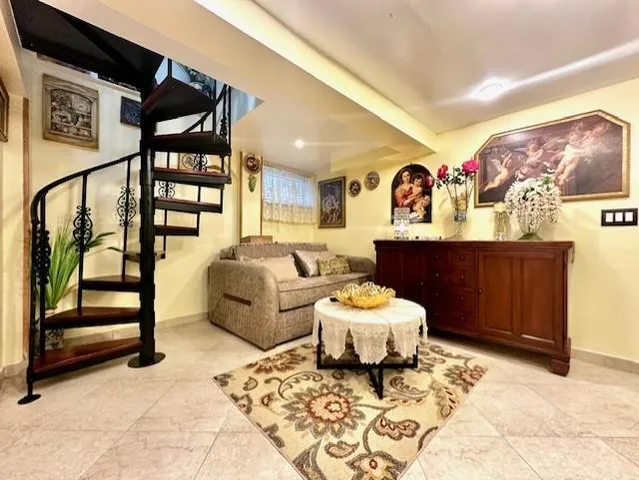 a living room with furniture and a rug