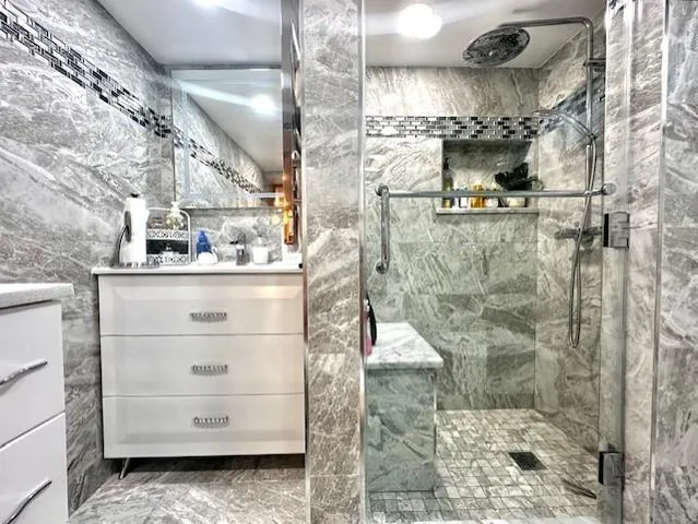 a bathroom with a bathtub and a shower