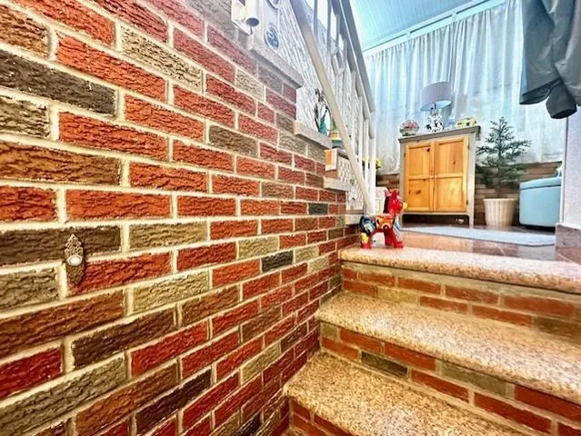 a bedroom with a bed and flat screen tv