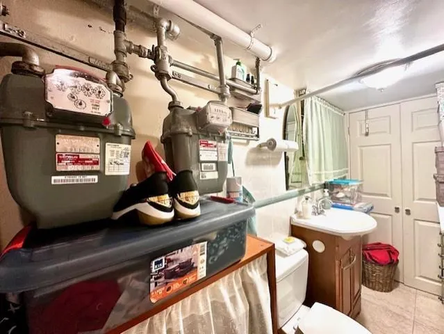 a utility room with multiple dryer and washer
