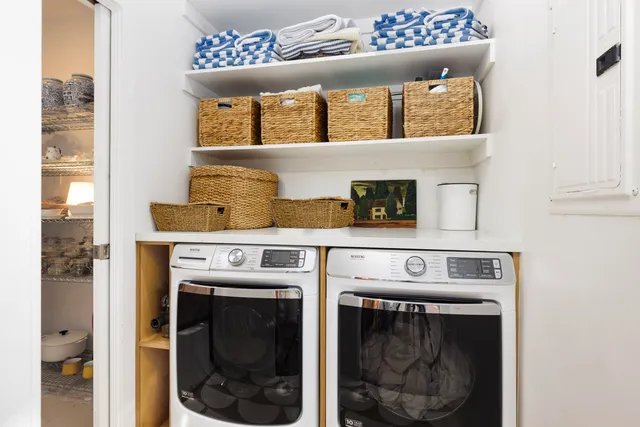 a utility room with washer and dryer