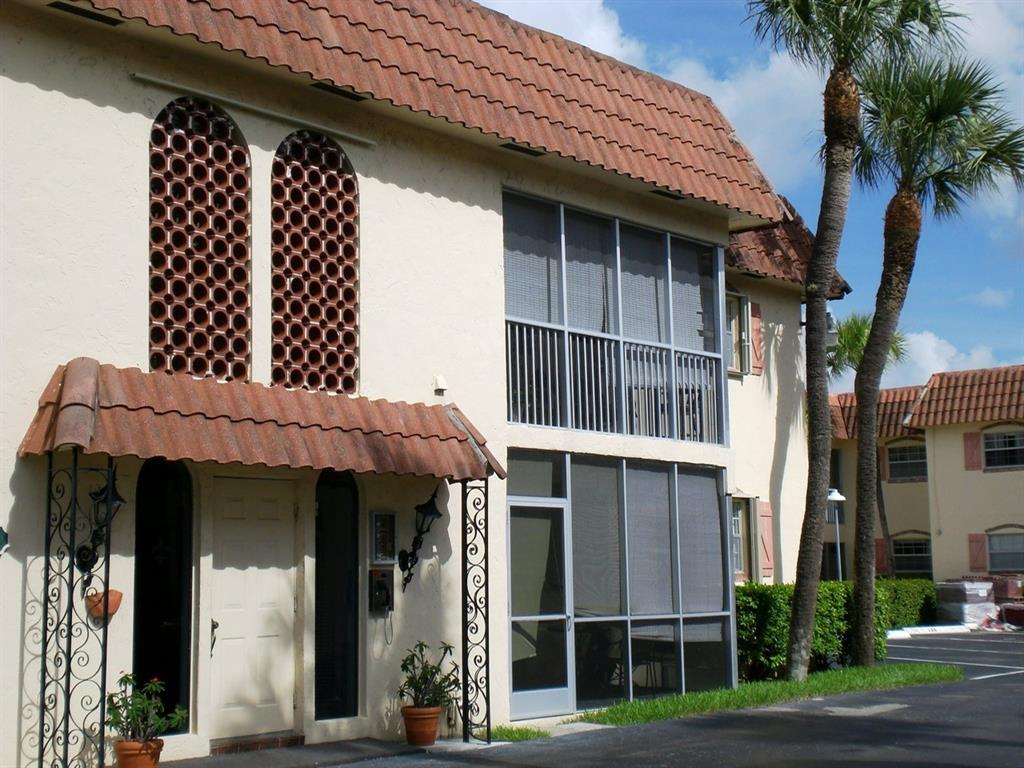 101 East McNab Road, Unit 428 Pompano Beach, FL 33060 - Photo 3 of 11 a view of a house with a large window