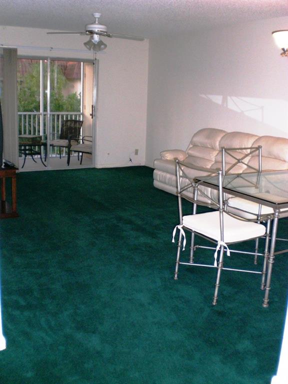 101 East McNab Road, Unit 428 Pompano Beach, FL 33060 - Photo 6 of 11 a view of a two chairs in the garden