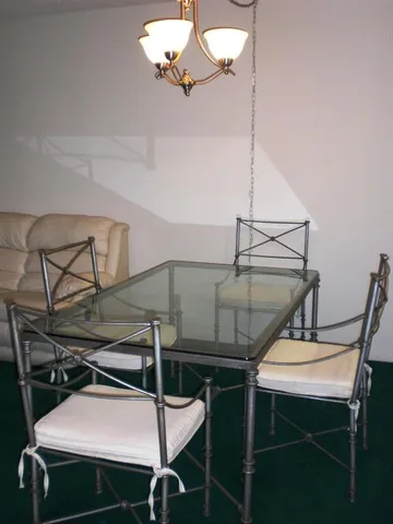 a balcony with furniture and a potted plant