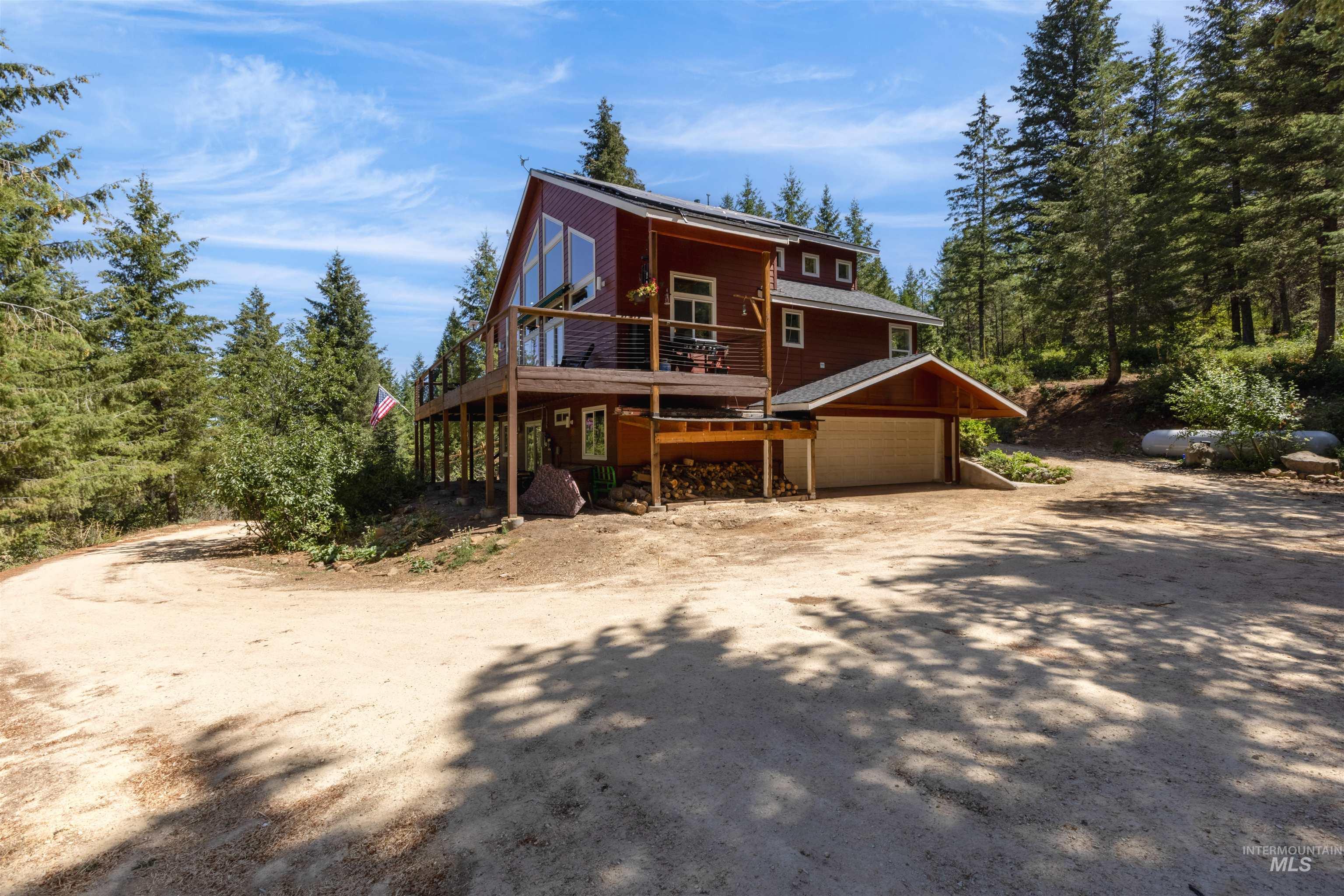 60 Highland Road Boise, ID 83716 - Photo 1 of 42 View of front facade featuring driveway and a deck