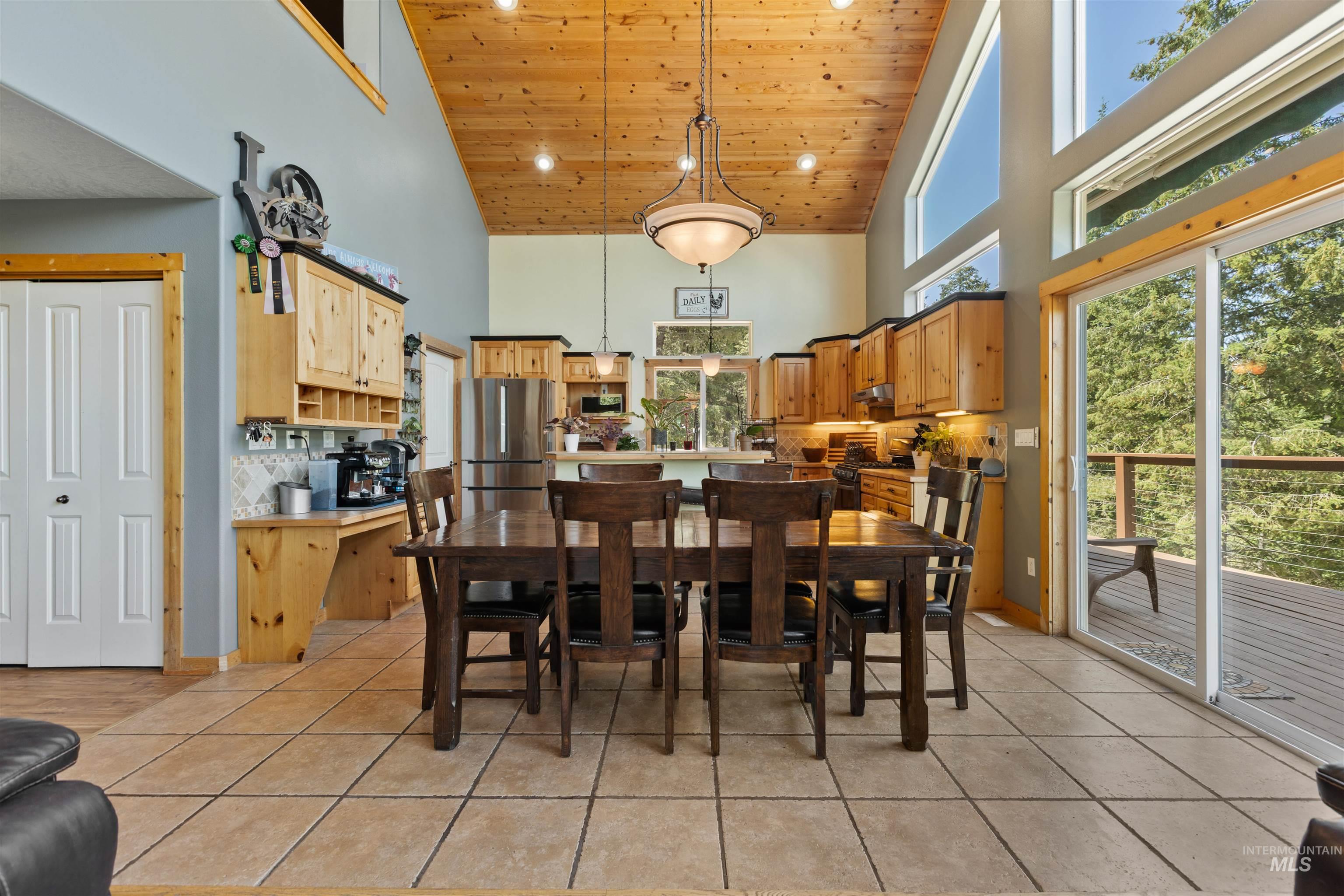 60 Highland Road Boise, ID 83716 - Photo 12 of 42 Dining area with wood ceiling, high vaulted ceiling, light tile patterned flooring, and recessed lighting