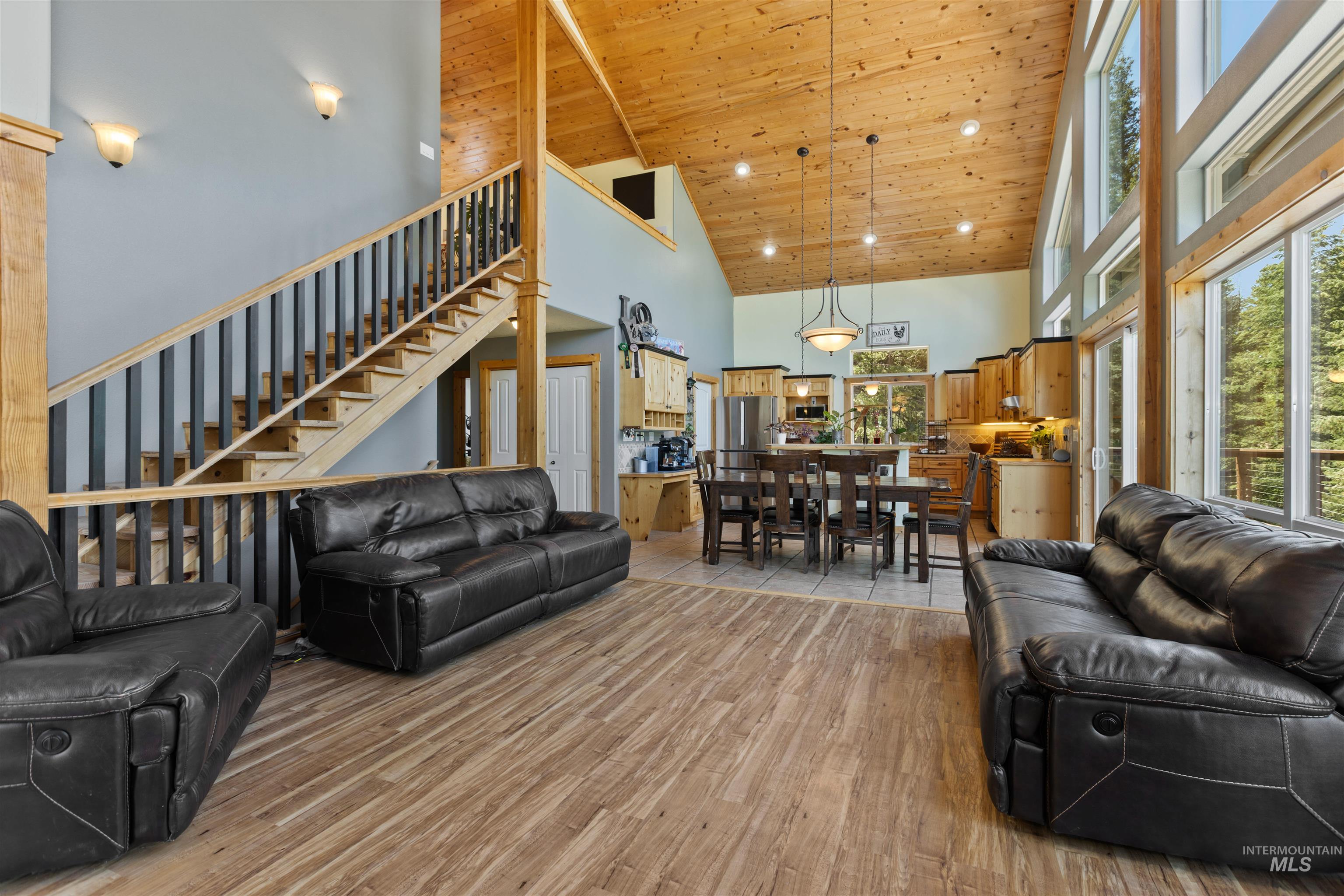 60 Highland Road Boise, ID 83716 - Photo 23 of 42 Living room with wood ceiling, high vaulted ceiling, light wood finished floors, and stairway