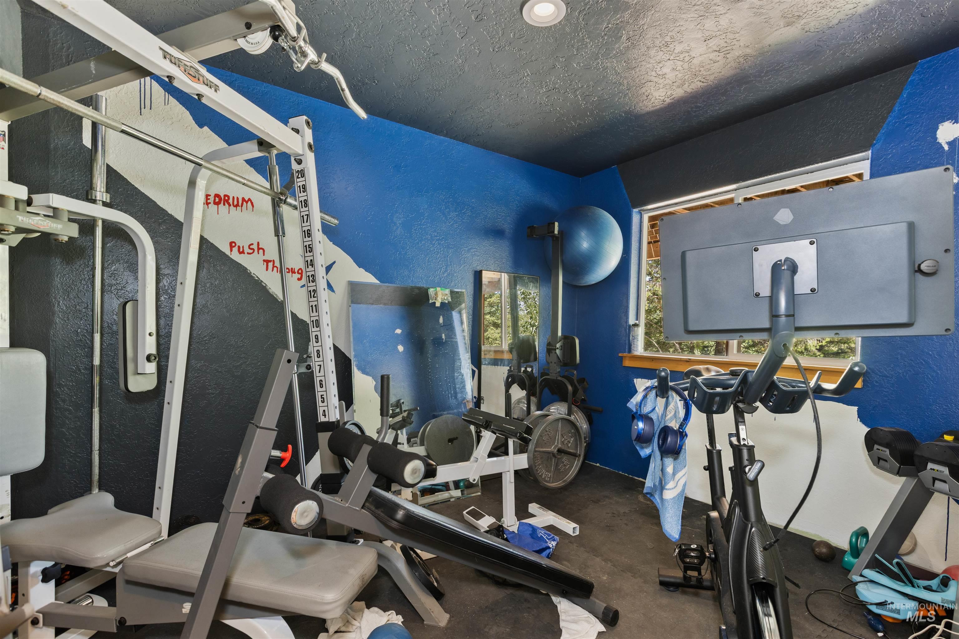 60 Highland Road Boise, ID 83716 - Photo 28 of 42 Exercise room featuring a textured wall and a textured ceiling
