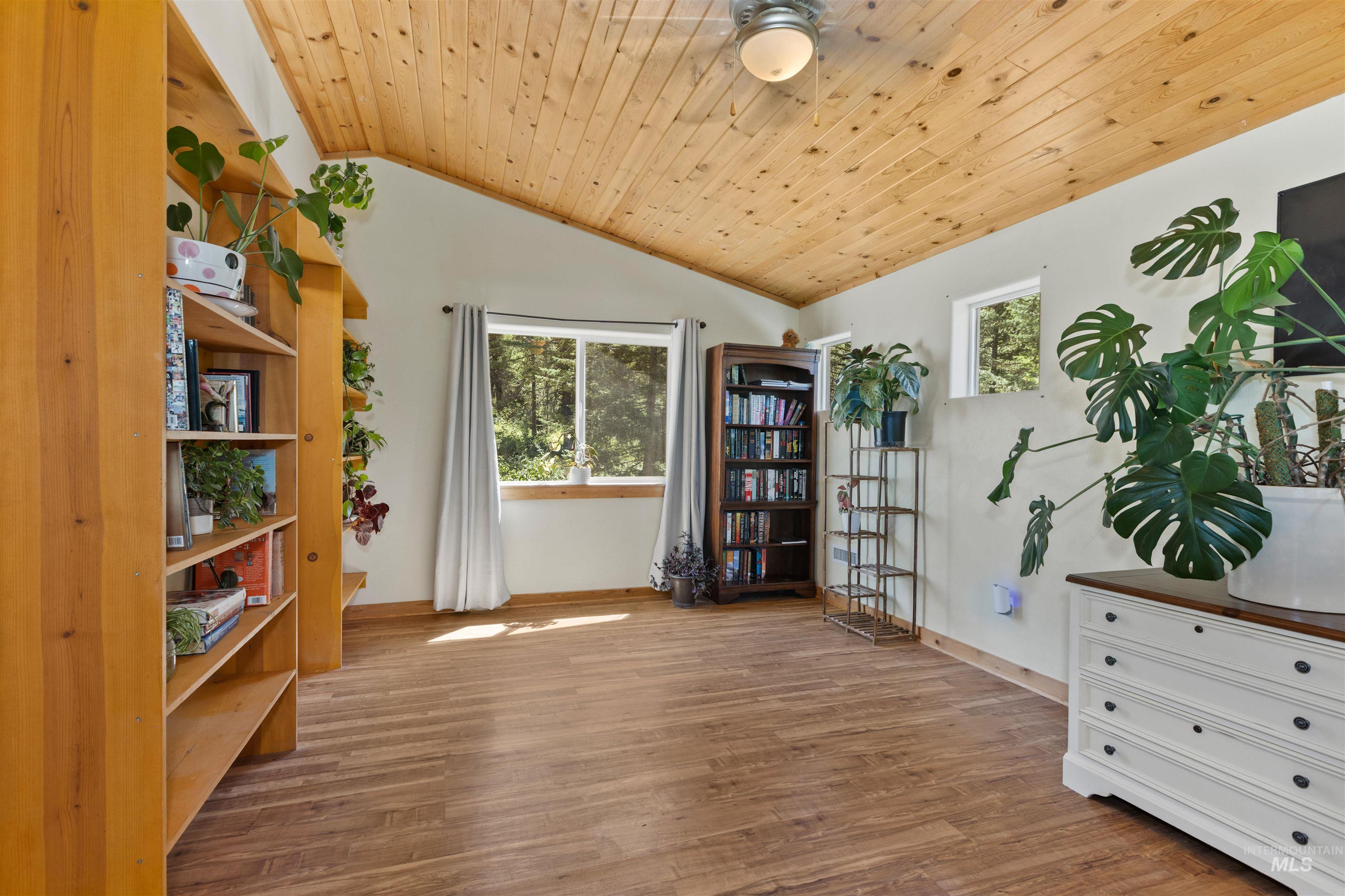 60 Highland Road Boise, ID 83716 - Photo 29 of 42 Sitting room featuring wood ceiling, wood finished floors, vaulted ceiling, a ceiling fan, and healthy amount of natural light