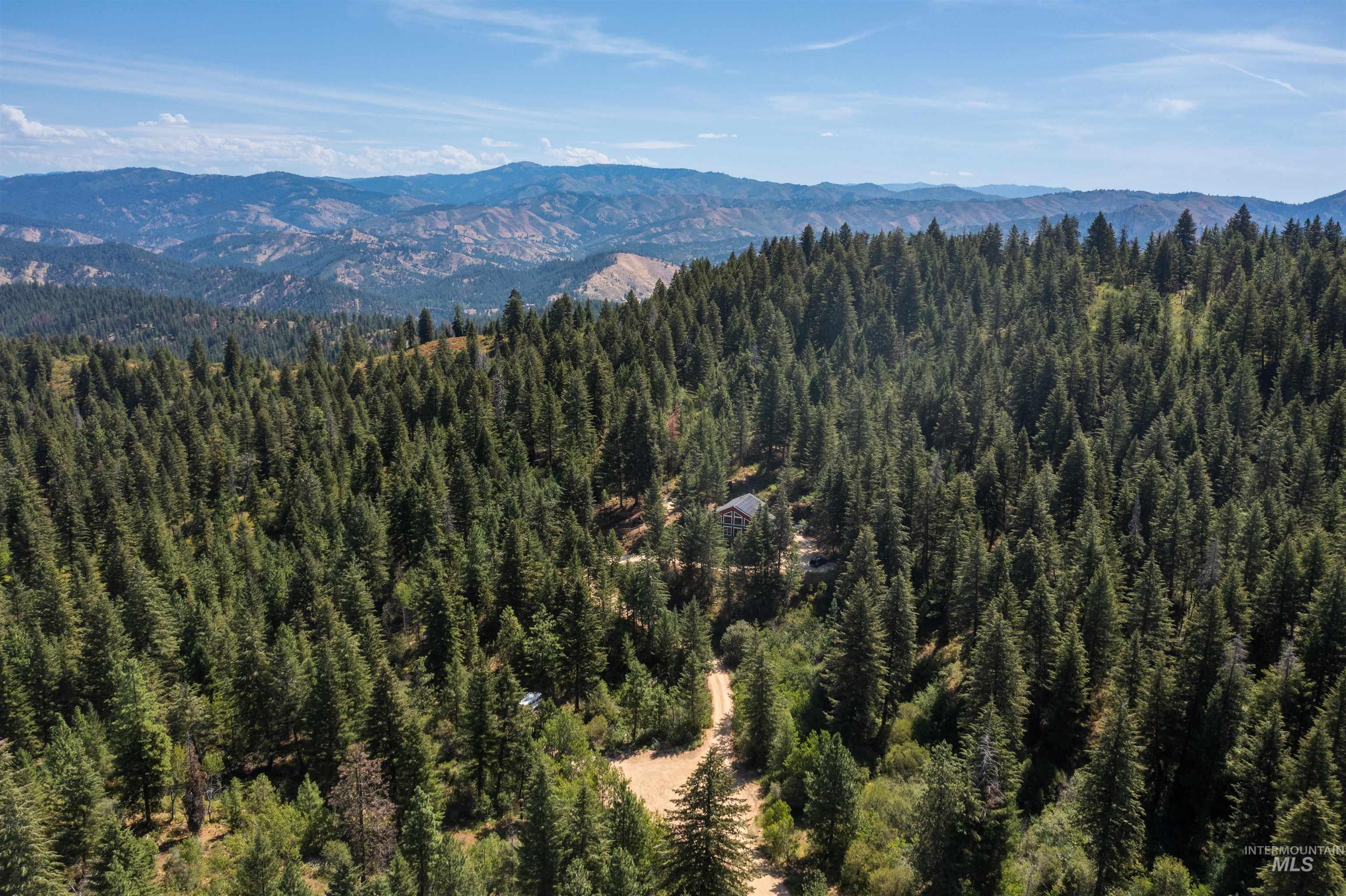 60 Highland Road Boise, ID 83716 - Photo 34 of 42 View of mountain backdrop with a heavily wooded area