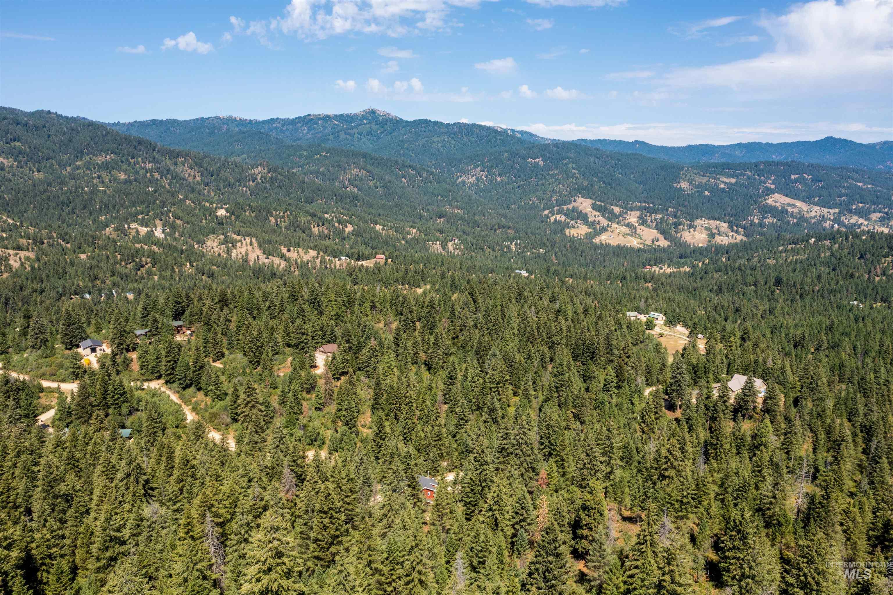 60 Highland Road Boise, ID 83716 - Photo 36 of 42 View of mountain backdrop featuring a forest