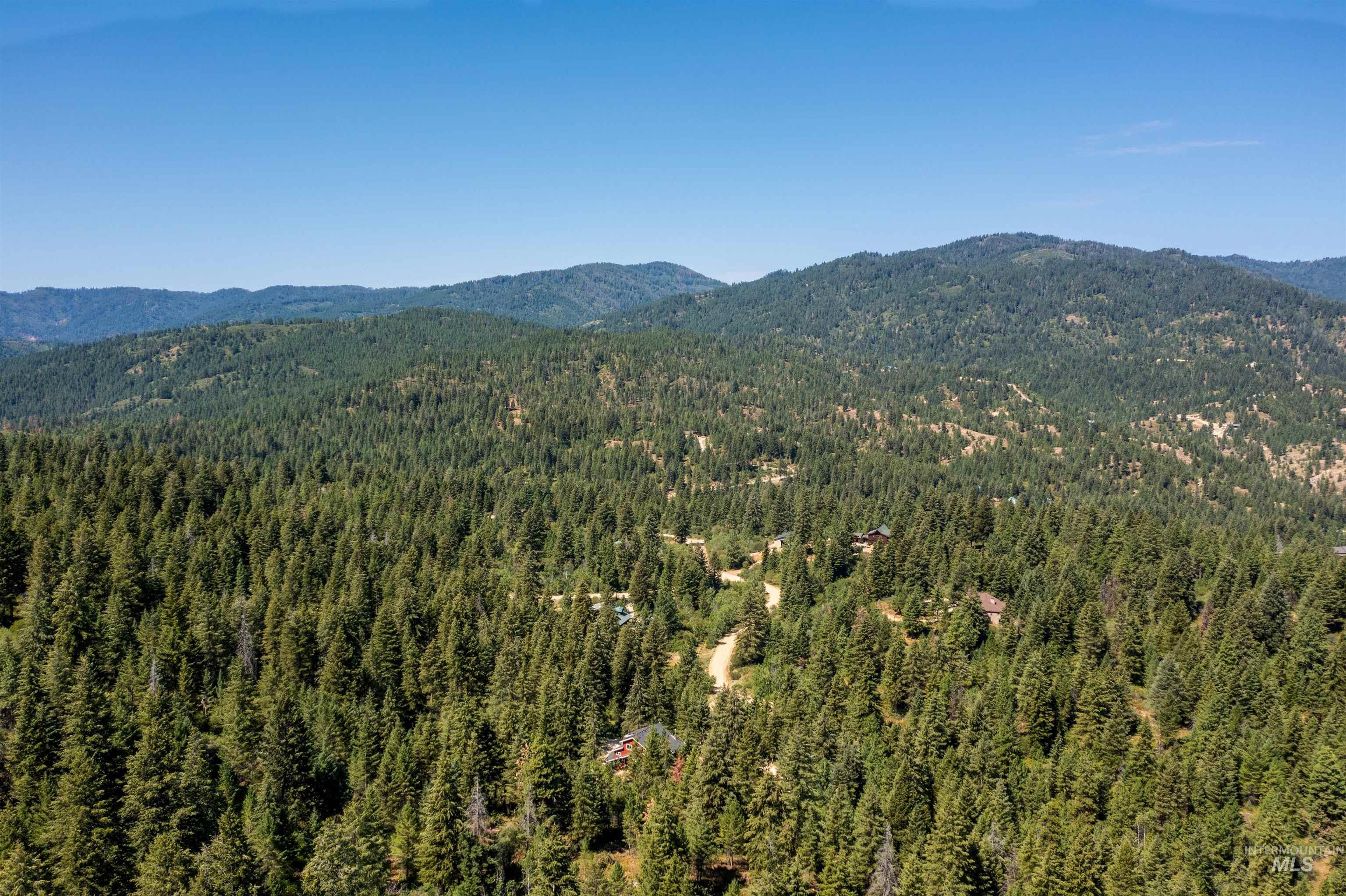 60 Highland Road Boise, ID 83716 - Photo 37 of 42 View of mountain background featuring a heavily wooded area