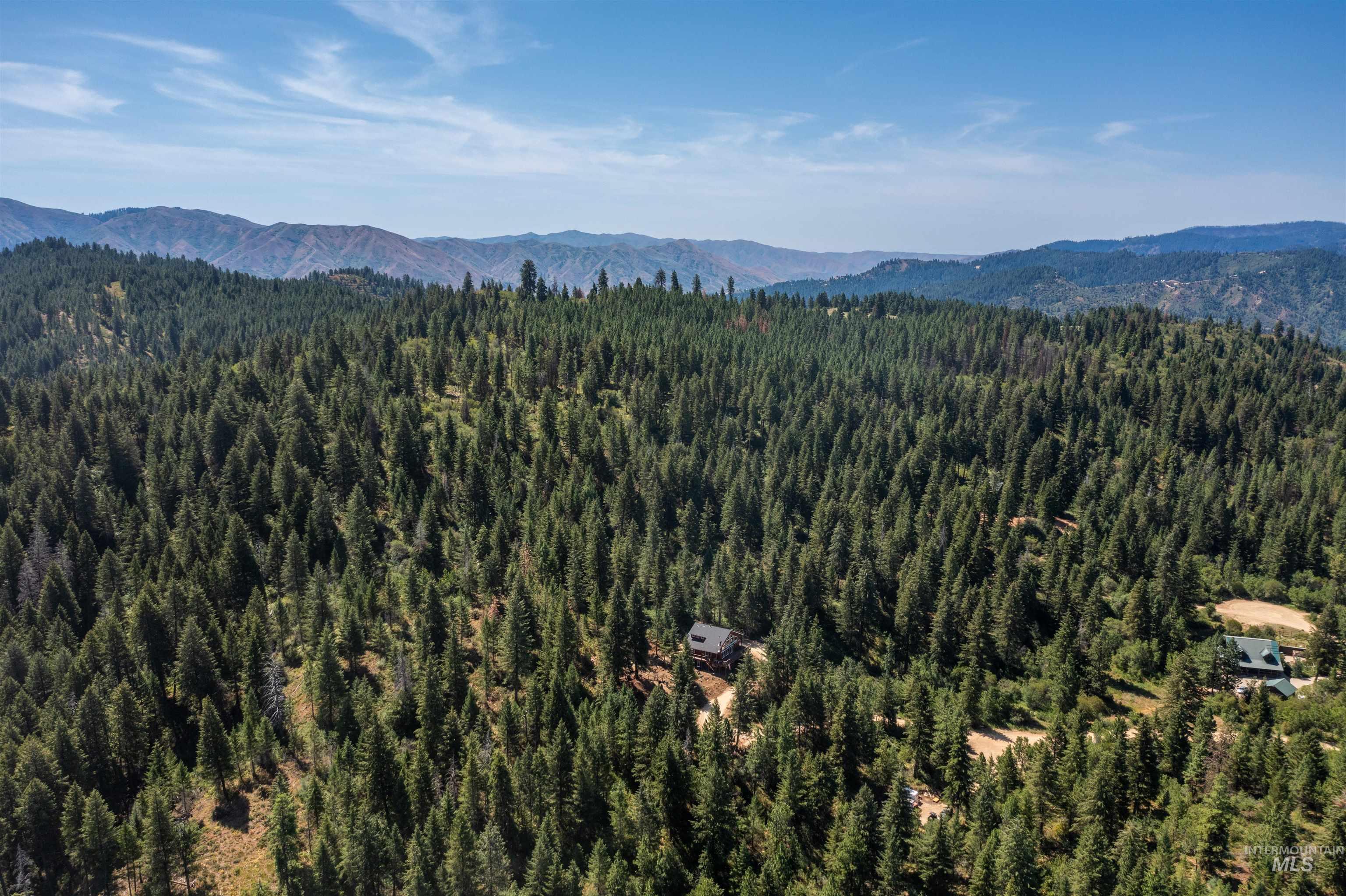 60 Highland Road Boise, ID 83716 - Photo 38 of 42 Mountain view featuring a heavily wooded area