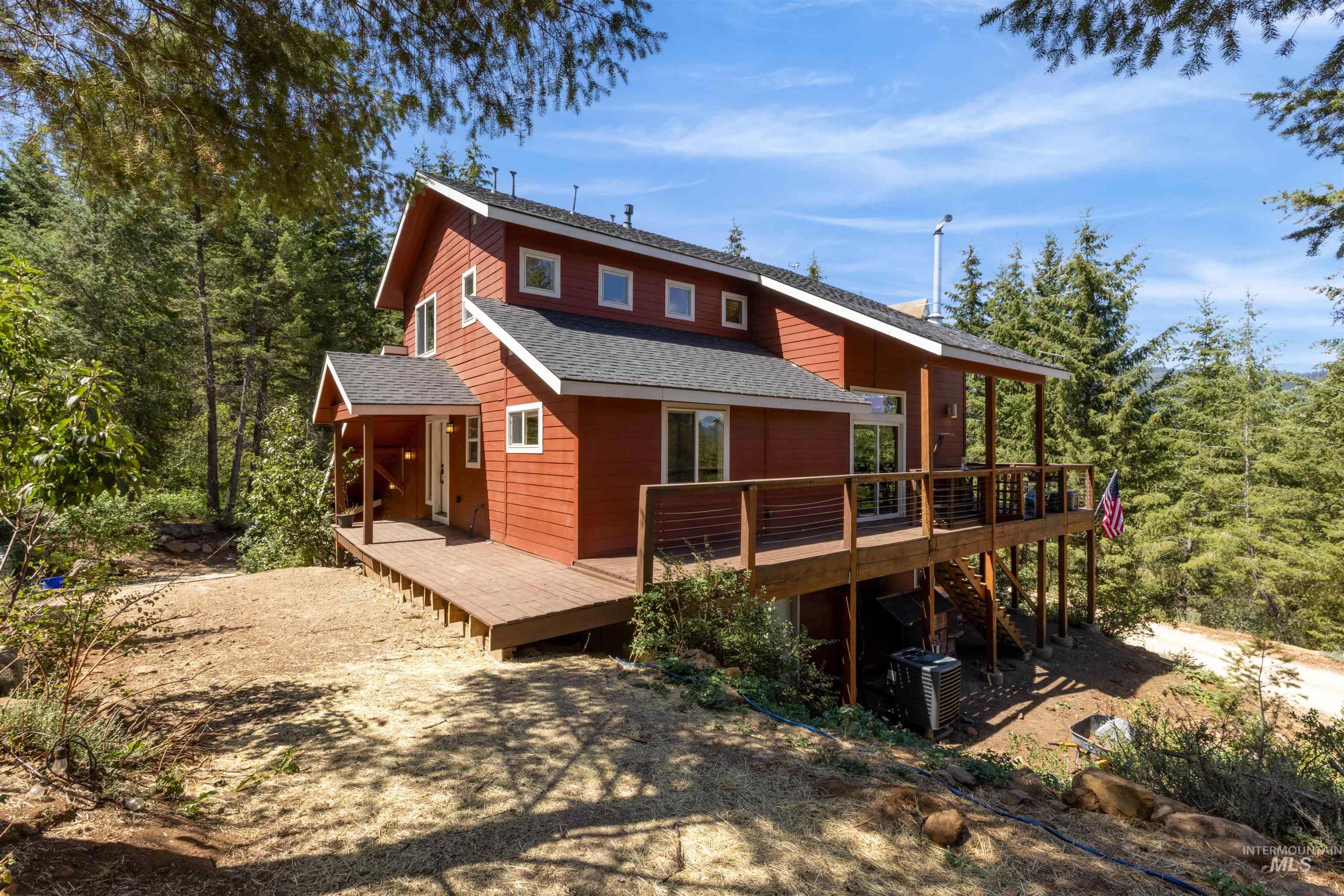 60 Highland Road Boise, ID 83716 - Photo 4 of 42 Back of house with a deck and roof with shingles