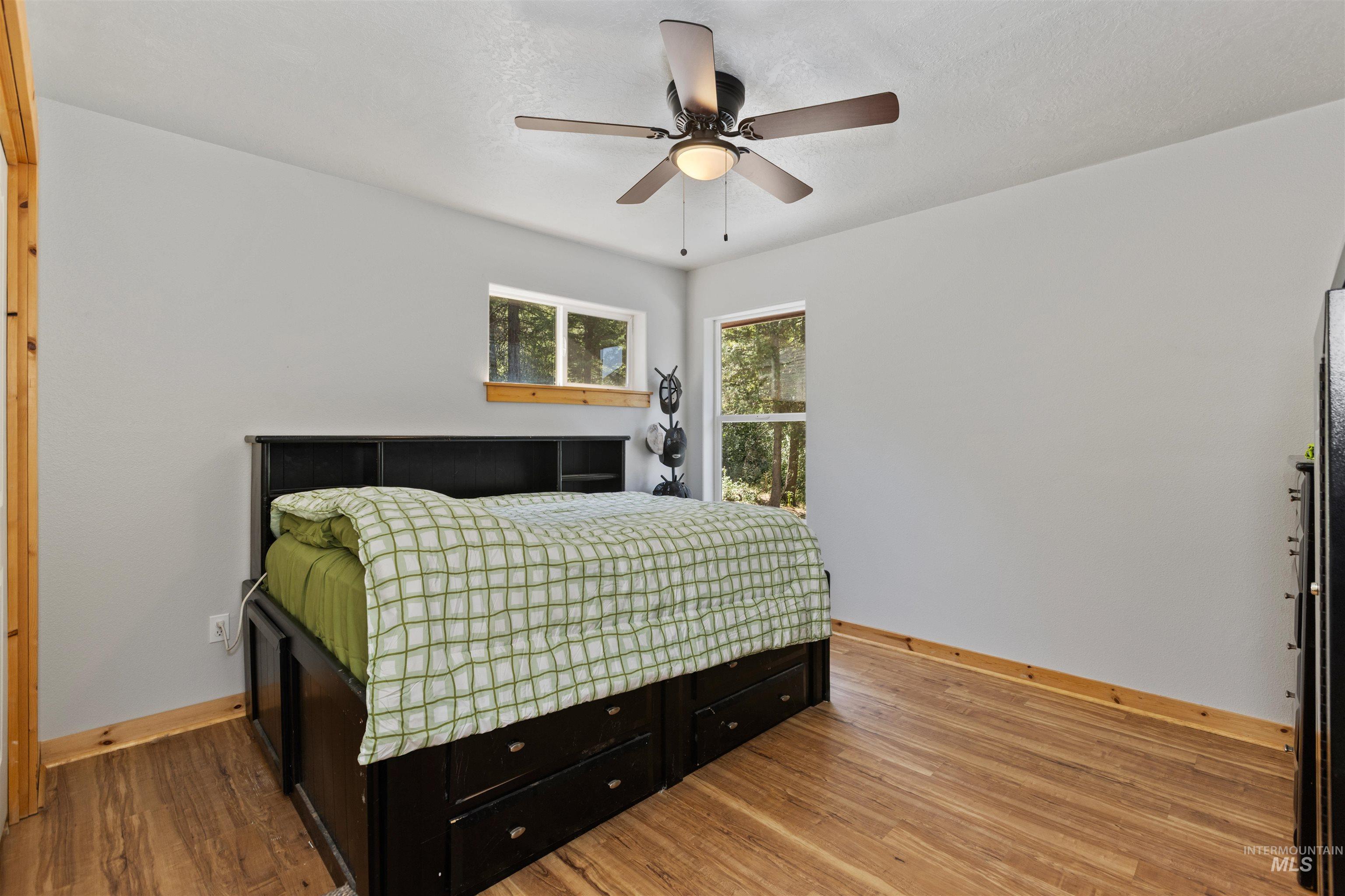 60 Highland Road Boise, ID 83716 - Photo 8 of 42 Bedroom featuring wood finished floors and ceiling fan