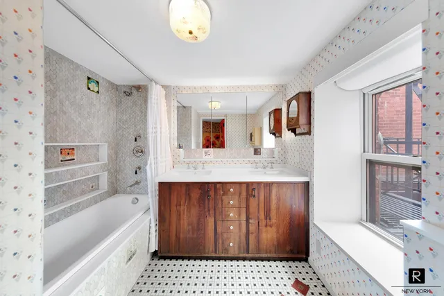 a bathroom with a sink a bathtub and a shower