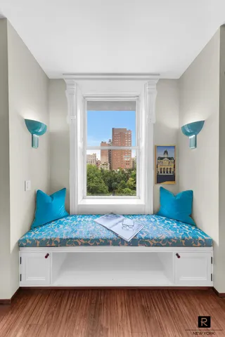 a living room with a rug floor and a table