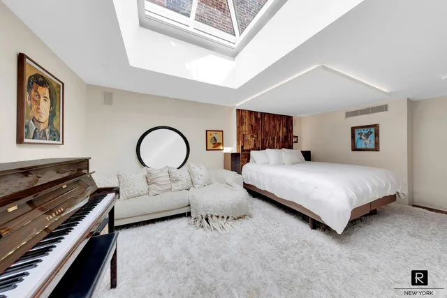 a bedroom with bed and a dresser