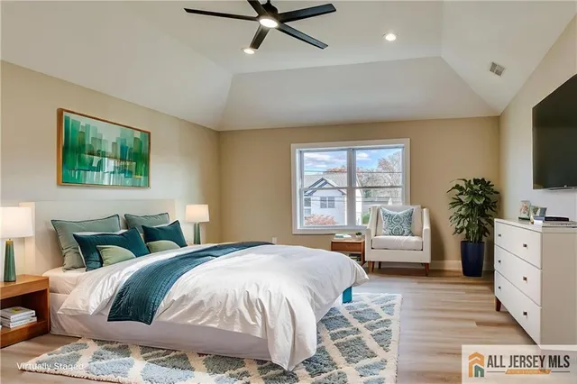 a bedroom with a large bed and a window