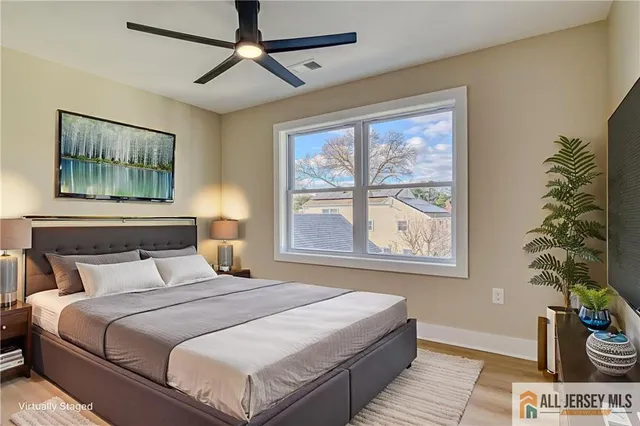 a bedroom with a large bed and a window